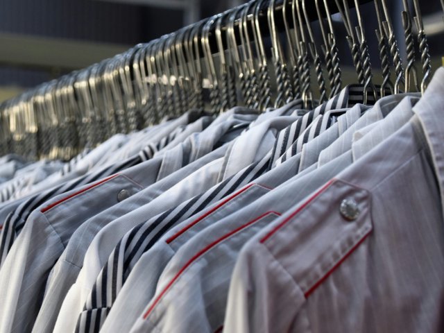 A selection of garments hanging on a clothes rail