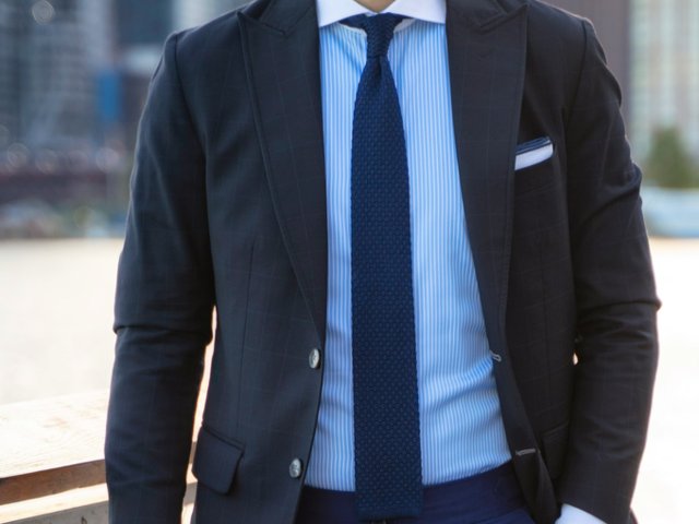 A person wearing a suit