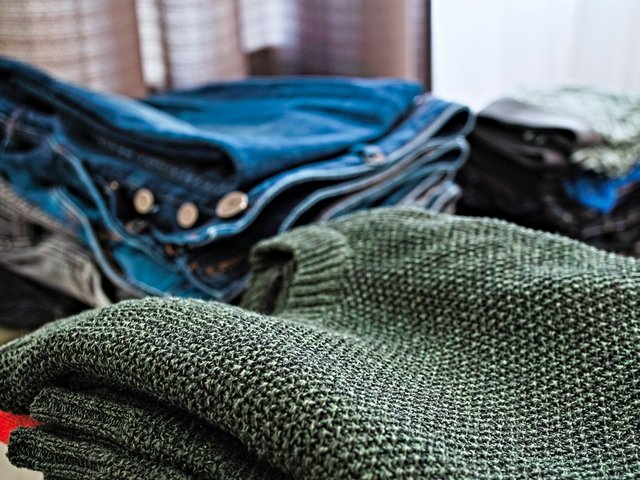 A variety of clothes in piles